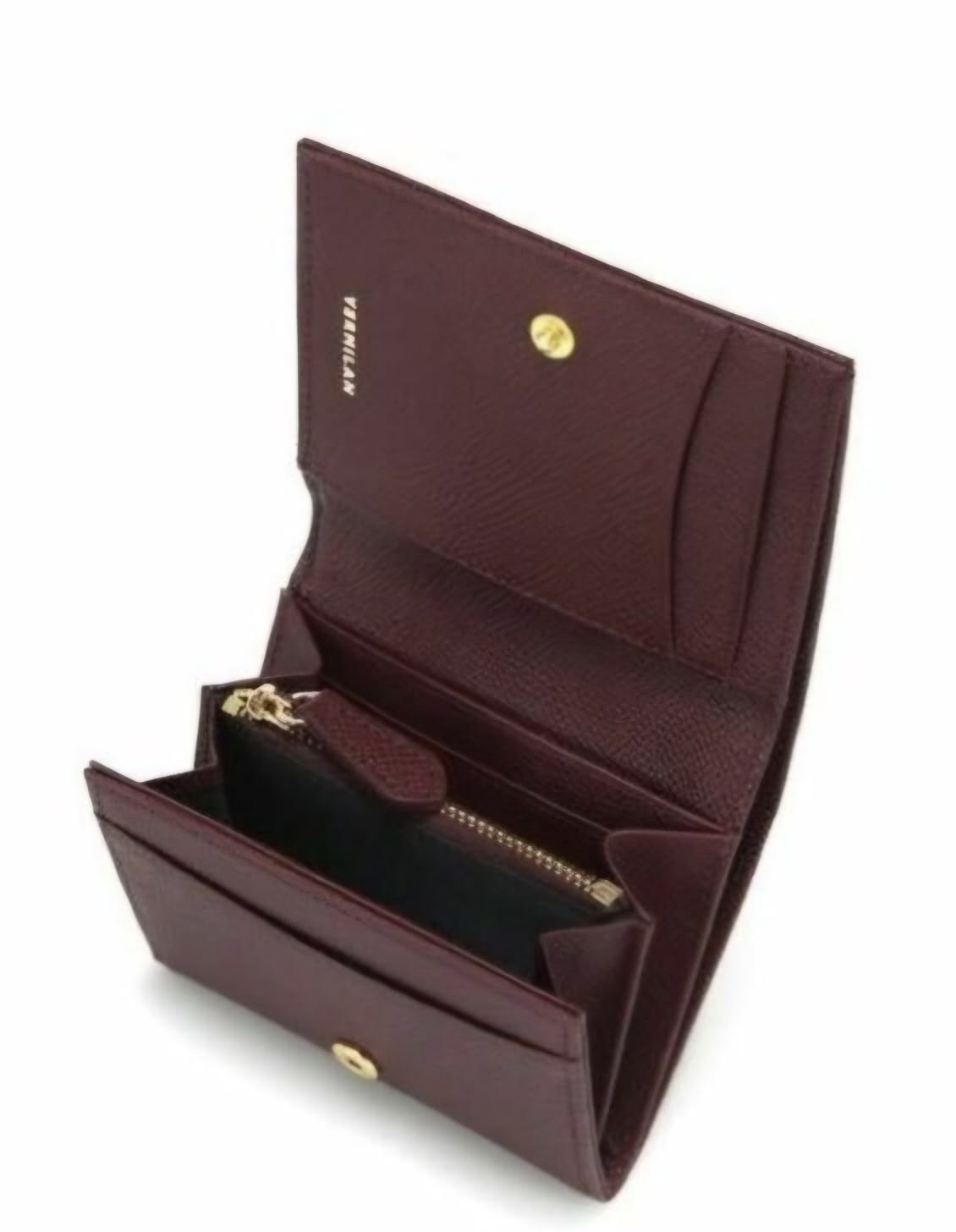 A burgundy leather wallet shown open, displaying its interior compartments, card slots, a zippered pocket, and gold-tone hardware. The brand name 'VERSACE' is subtly embossed on the inside flap.