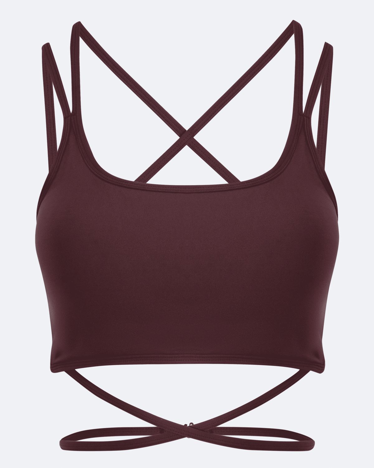 A dark burgundy sports bra with thin crisscrossing shoulder straps and a matching tie detail at the underbust, shown against a light gray background.